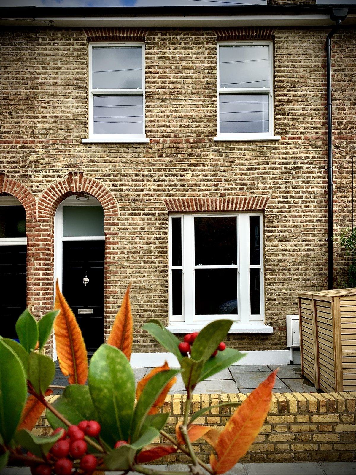 Terraced house with new white timber box sash windows on both floors
